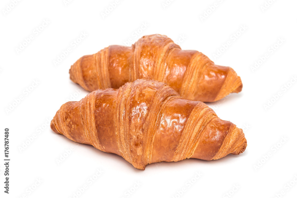Two fresh croissant isolated on white background,