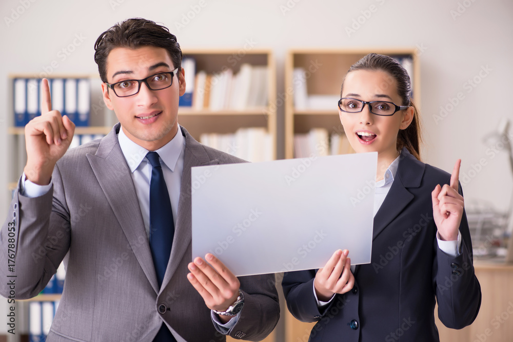 Businessman and businesswoman having discussion in office Businessman and businesswoman having discussion in office