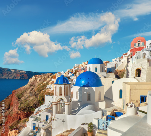 Fotografie Local church with blue cupola in Oia, Santorini, Greece, panorama