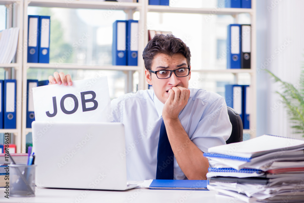 Young businessman looking for job in unemployment concept Young businessman looking for job in unemployment concept