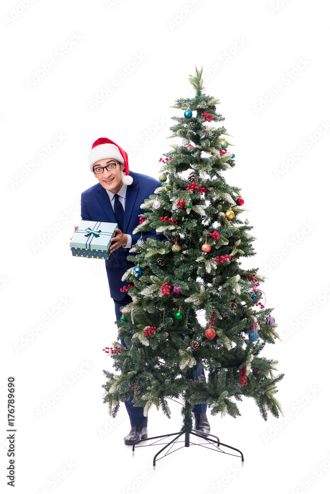 Businessman decorating christmas tree isolated on white Businessman decorating christmas tree isolated on white