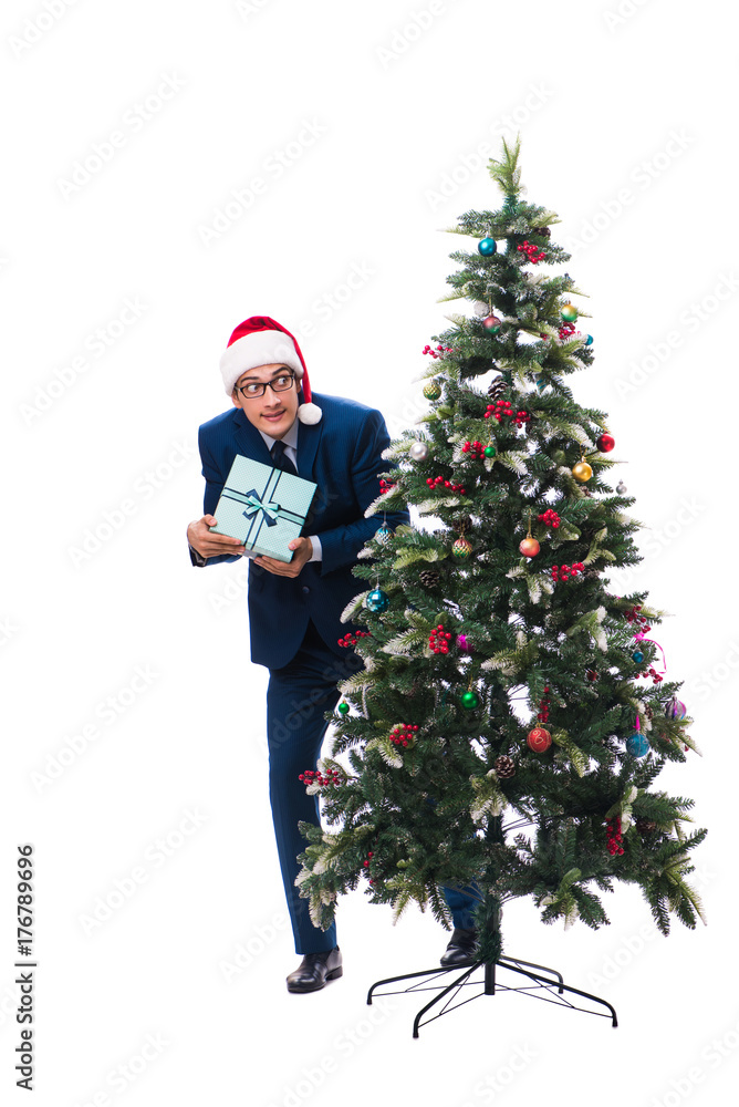 Businessman decorating christmas tree isolated on white Businessman decorating christmas tree isolated on white
