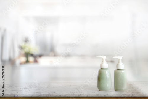 Ceramic Shampoo and Soap Bottle on marble counter and bathroom background.