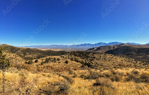 View of the Salt Lake Valley and Wasatch Front desert Mountains in Autumn Fall hiking Rose Canyon Yellow Fork, Big Rock and Waterfork Loop Trail in the Oquirrh Mountains, Utah, USA.