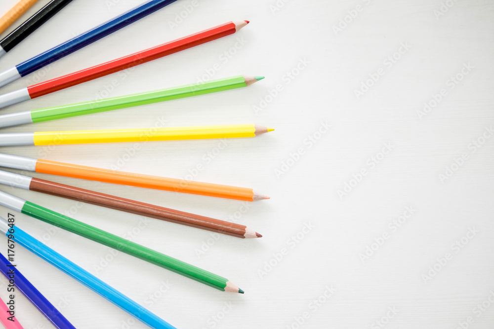 Wooden Pencil Colours are putting on wooden white table. Wooden Pencil Colours are putting on wooden white table.