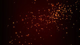 gold particles on dark red background christmas holidays concept