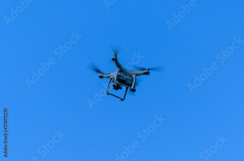 White drone in blue sky