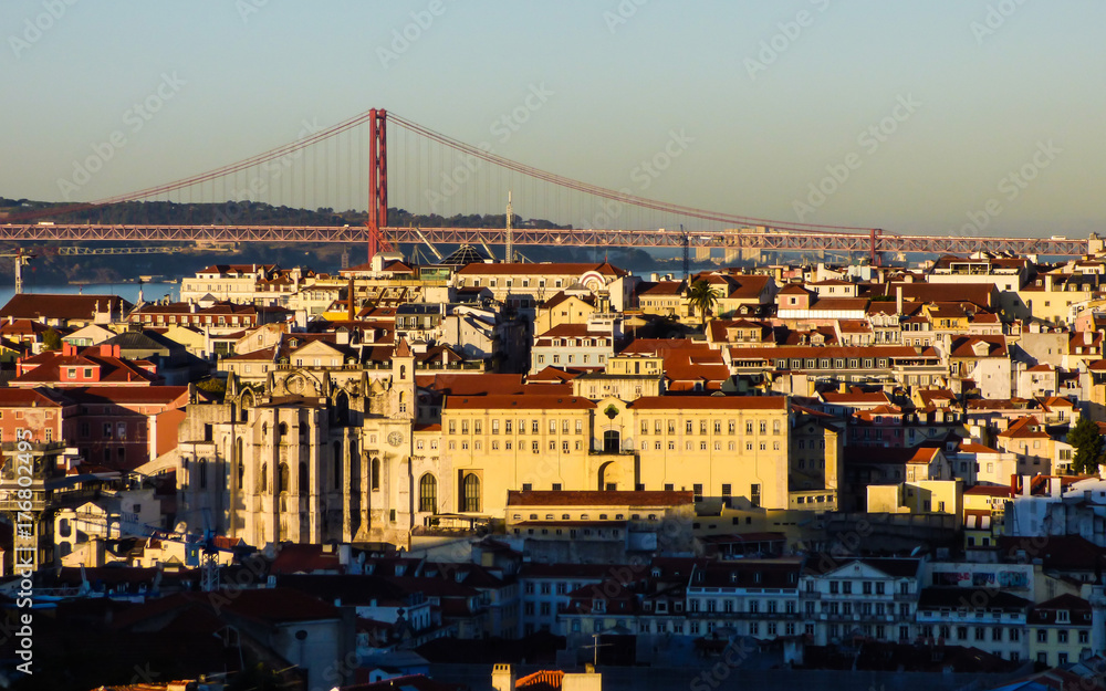 Beautiful cityscape of Lisbon with the Tagus river, the 25th of April bridge and historic buildings viewed from Miradouro Sophia de Mello