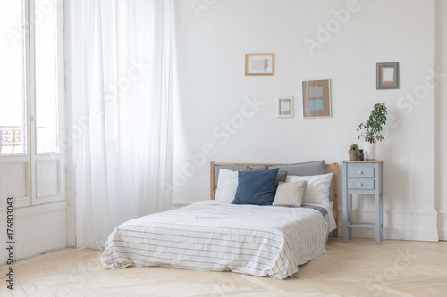 Interior of white and gray cozy bedroom