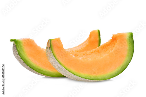 two slice of japanese melons, green melon or cantaloupe melon with seeds isolated on white background
