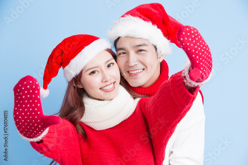 couple smile with merry christmas