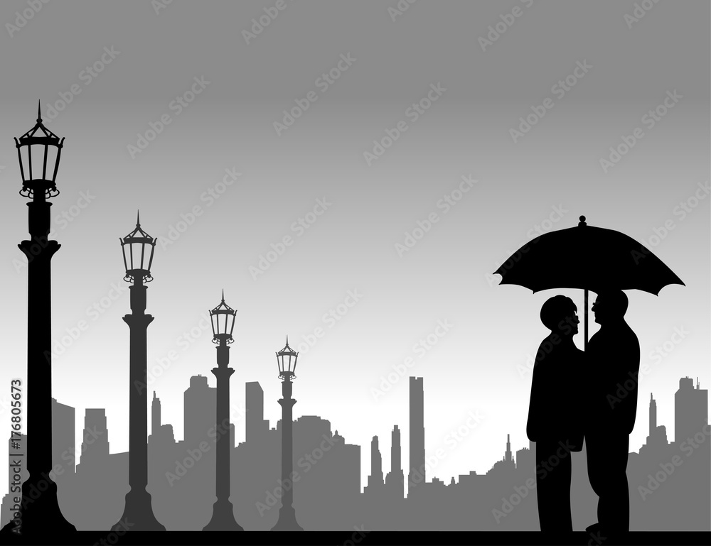 Lovely retired elderly couple stands under the umbrella on the street in autumn or fall, one in the series of similar images silhouette