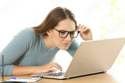 Woman with eyesight problems trying to read photo