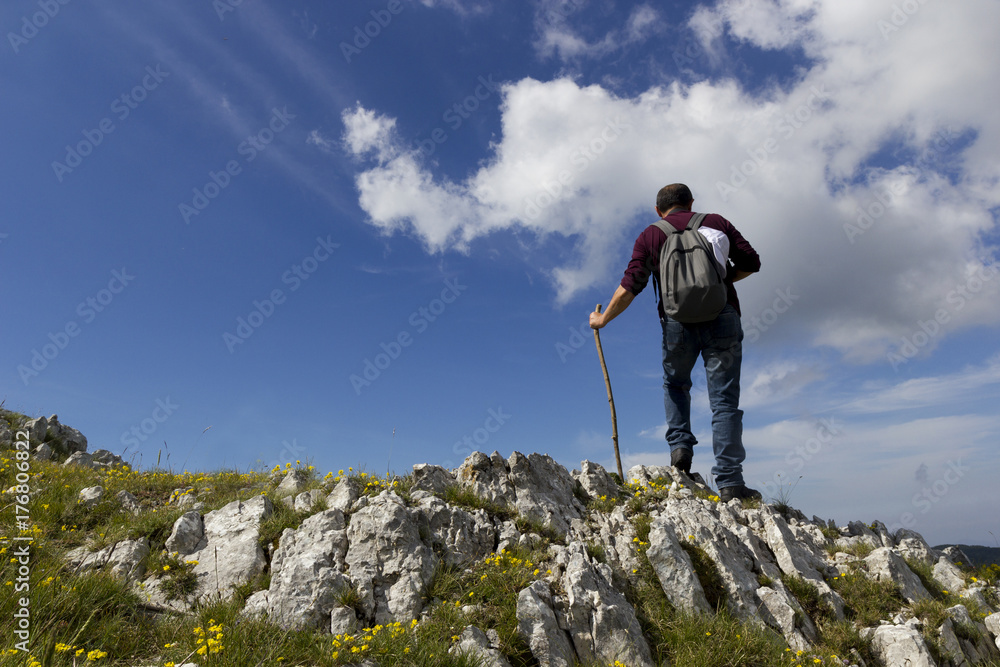 hiker on mountain trail