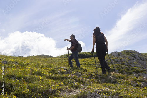 man and woman hikers on mountain