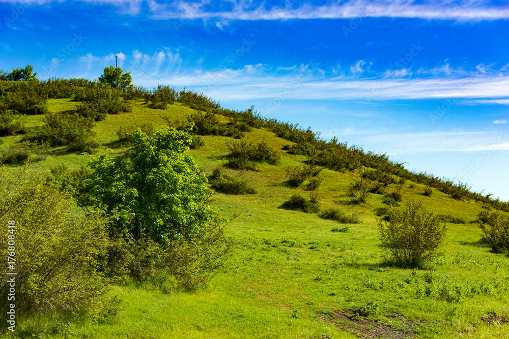 Green hills and blue sky