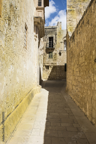 Street with traditional maltese buildings in Mdina