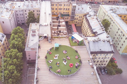 Aerial view of the people relax on the roof of a multistory building