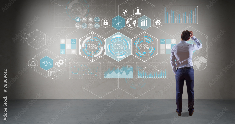 Businessman watching chart screens interface on a wall 3D rendering Businessman watching chart screens interface on a wall 3D rendering