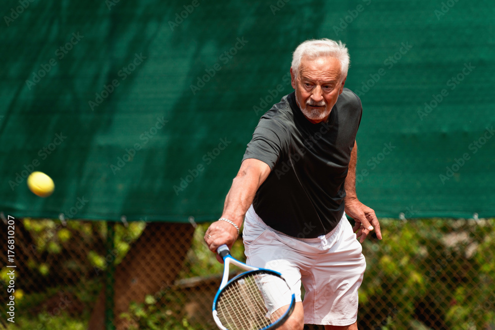 Senior Man Playing Tennis