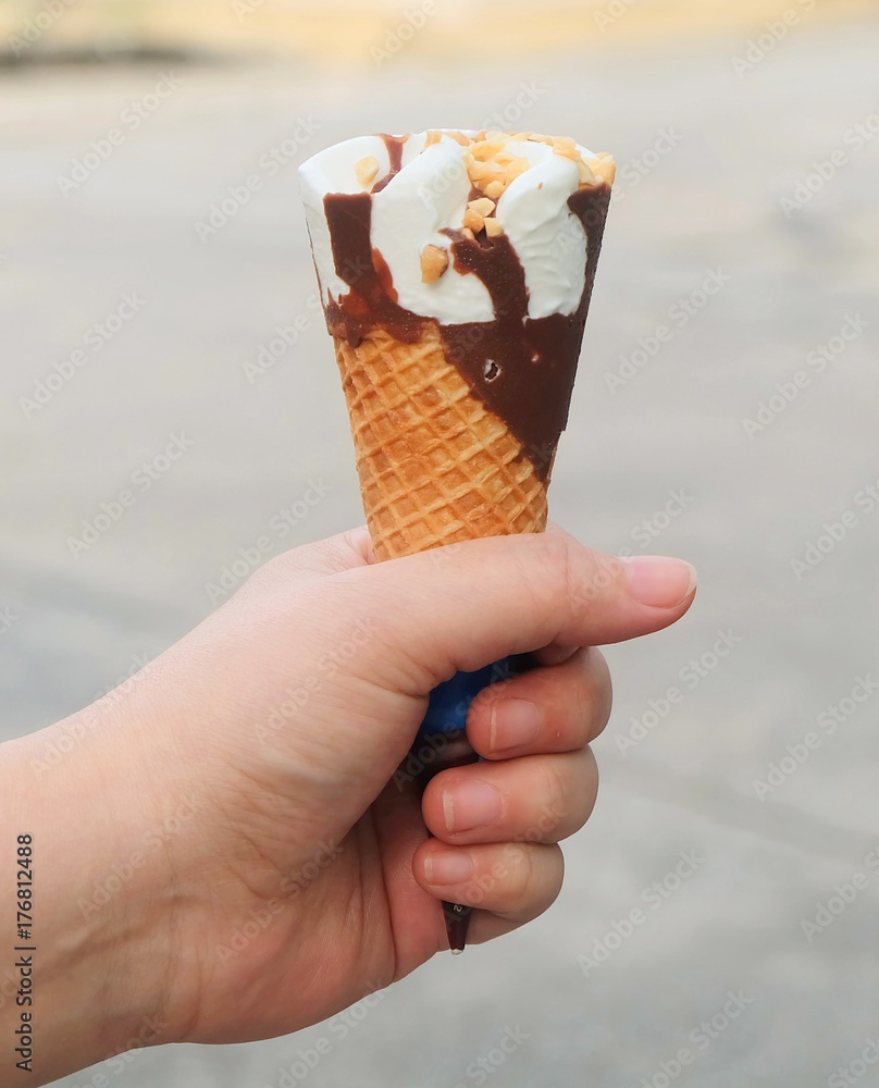 Hand Holding Ice Cream Cones with Chocolate Hand Holding Ice Cream Cones with Chocolate
