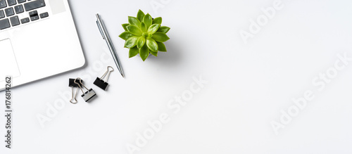 Overhead shot of office accessories on white background