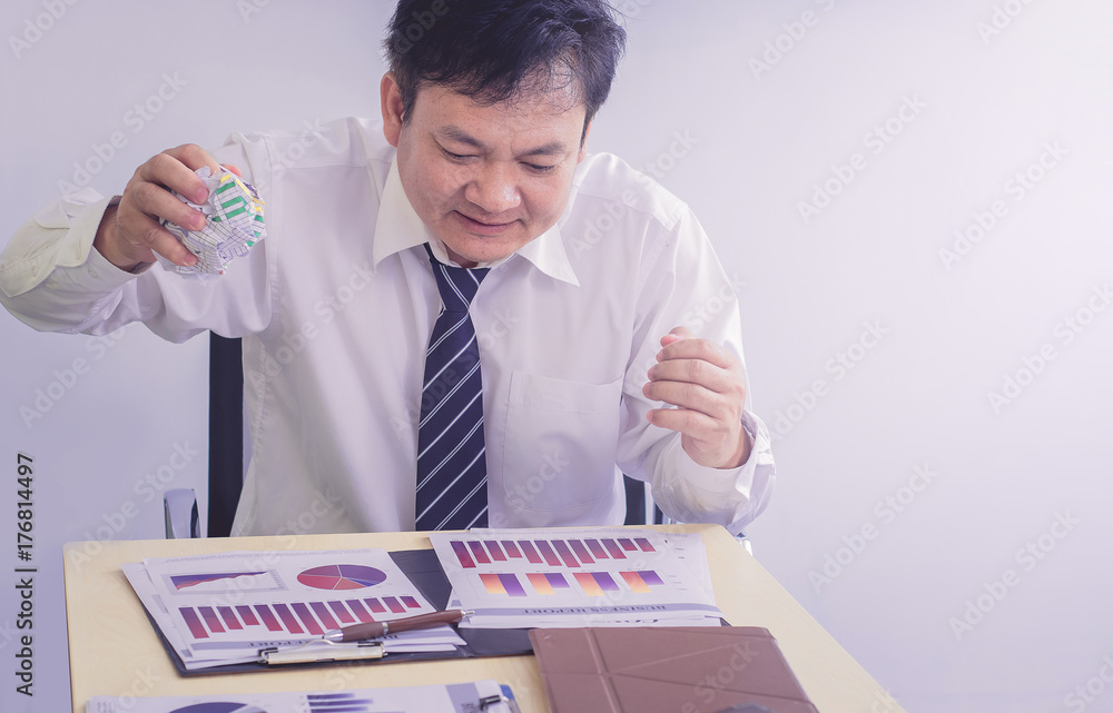 Bad investment or economic crisis concept. Businessman is disappointed from losing in business situation Bad investment or economic crisis concept. Businessman is disappointed from losing in business situation
