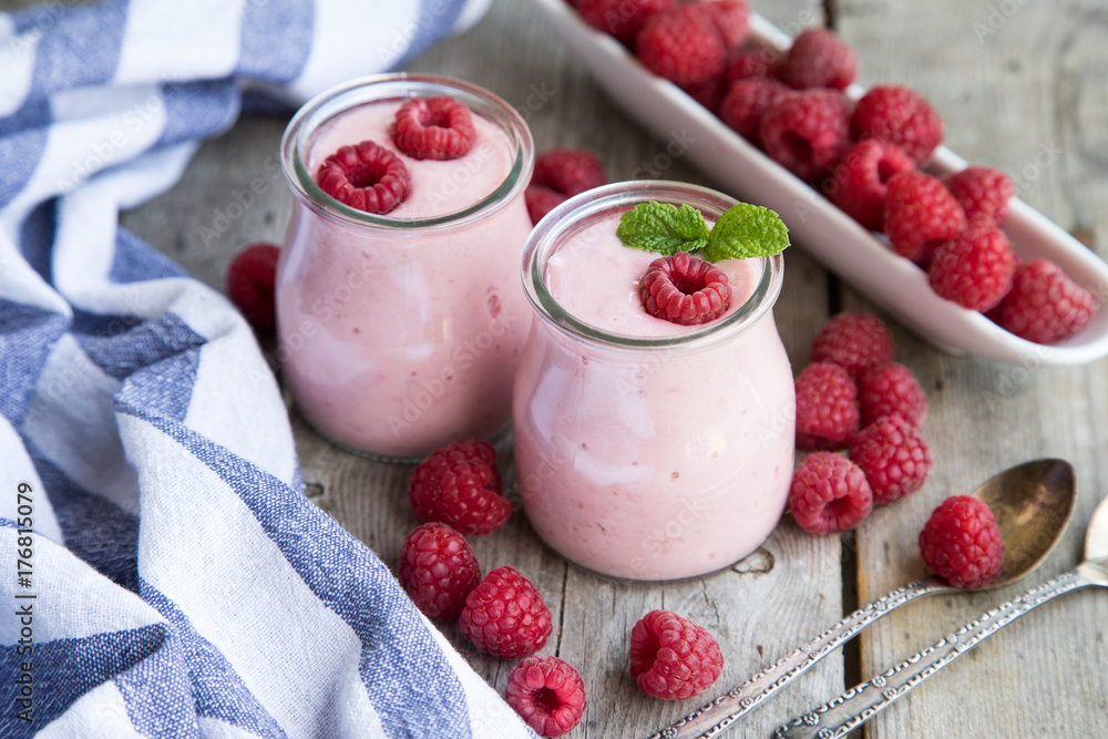 Yogurt smoothie with raspberries, fruit dessert. Berry smoothie. healthy dieting concept Yogurt smoothie with raspberries, fruit dessert. Berry smoothie. healthy dieting concept