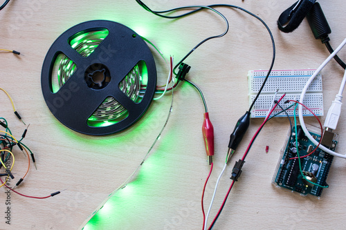 RGB led strip addressable controlled by a microcontroller open source to have green color flux. Maker project for DIY environment lighting. Lights for wearable photo