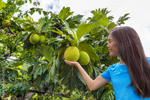 French Polynesia travel tourist girl with breadfruit