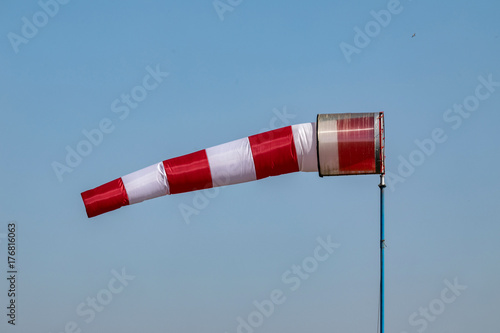 Airport windsock on clear blue sky background in windy weather indicate the local wind direction,air sock, drogue, wind sleeve, wind cone