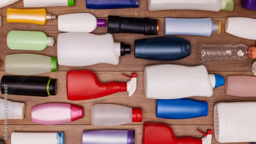 Plastic waste bottles filling a table sliding through screen - stop motion animation