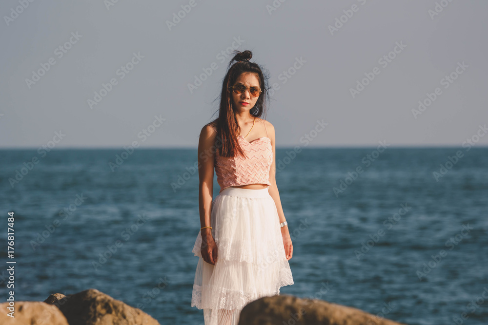 Girl women Asian hipster wearing a white skirt by the sea Girl women Asian hipster wearing a white skirt by the sea