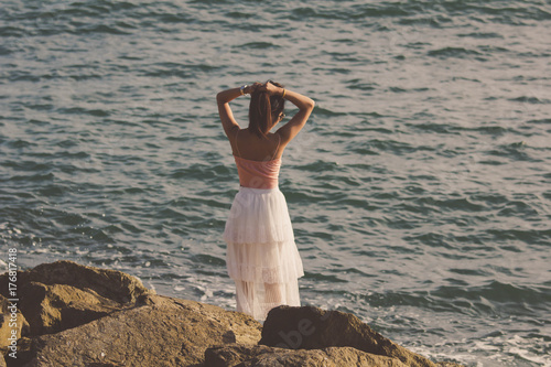 Girl women Asian hipster  wearing a white skirt by the sea © 3rus