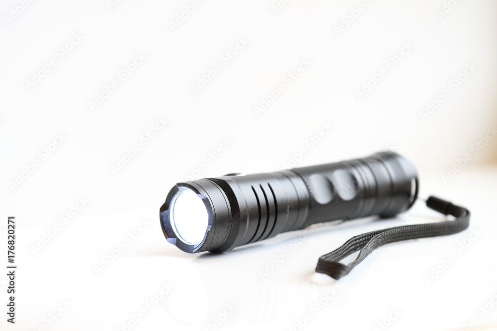 Manual black flashlight, reliability, quality, shine Manual black flashlight, reliability, quality, shine