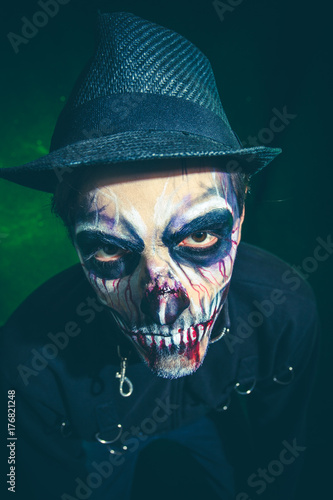 scary halloween skeleton man in jacket and hat studio shot © Coka