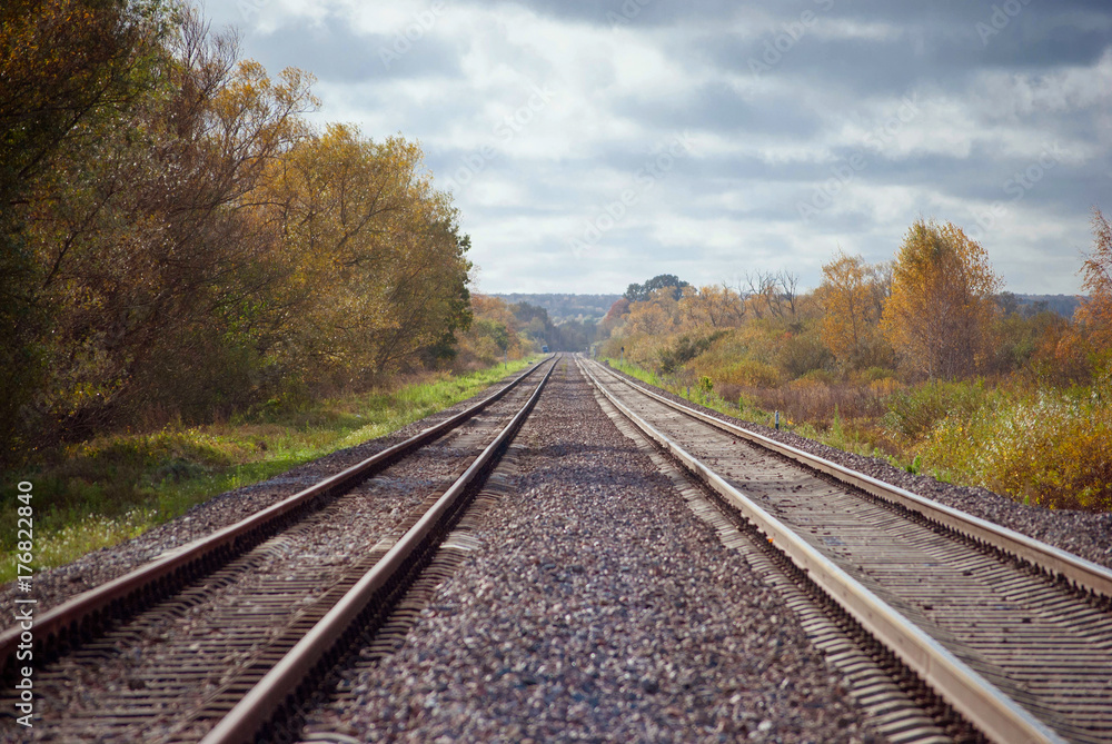 Railway, two railroad tracks goes parallel, horizontal shot