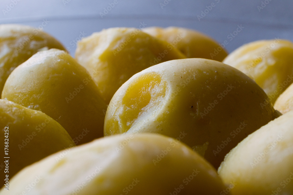 Boiled Potatoes in glass bowl on grey surface. Boiled Potatoes in glass bowl on grey surface.