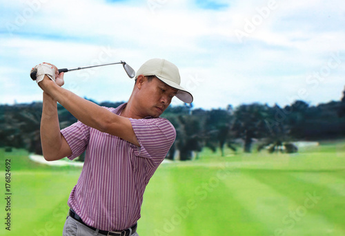 Man player golf swing shot on course 