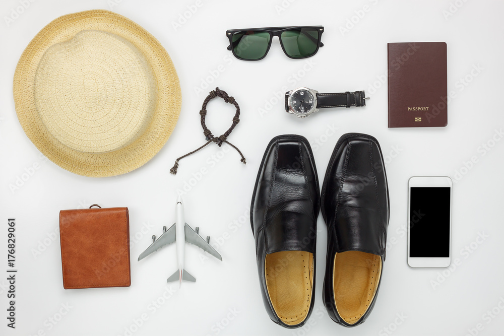 Flat lay of accessories travel and fashion men concept background.Essential items for trip on the white wooden at home office desk.Variety objects for gentlemen adult or teenage and traveler. Photo