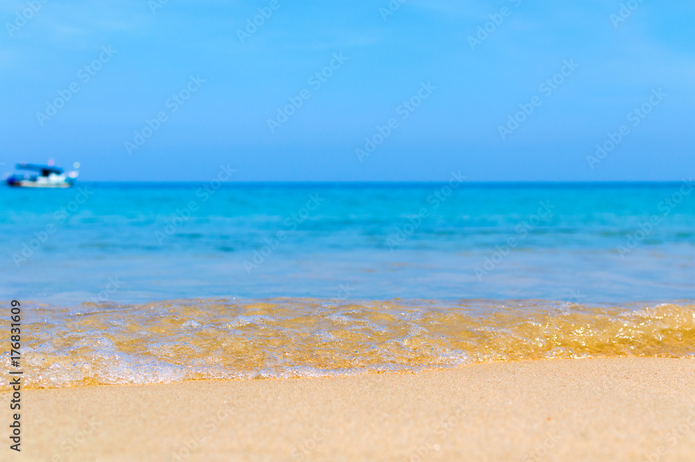 Soft Wave Of Blue Ocean On Sandy Beach. Background. Selective focus