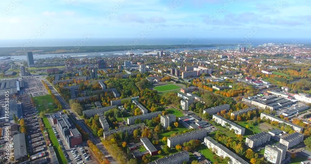 KLAIPEDA, LITHUANIA - OCTOBER 15, 2017: AERIAL. Smooth drone flight through Klaipeda City at high altitude KLAIPEDA, LITHUANIA - OCTOBER 15, 2017: AERIAL. Smooth drone flight through Klaipeda City at high altitude