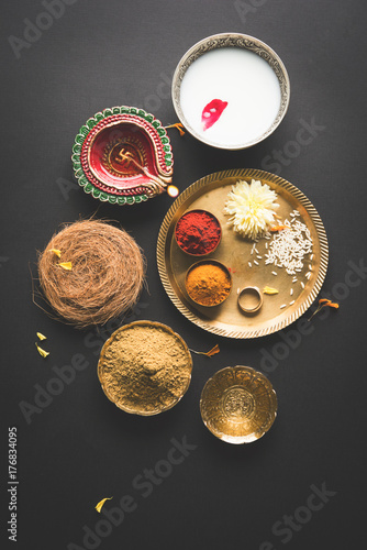 Abhyanga Snan on first day of Diwali - special herbal bath with ubtan or Utne, a mix herbal powder to have bath and scrub on the occasion of Diwali, selective focus

 photo