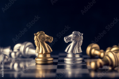 Chess on a chessboard at black background  Business leader concept. vintage tone.