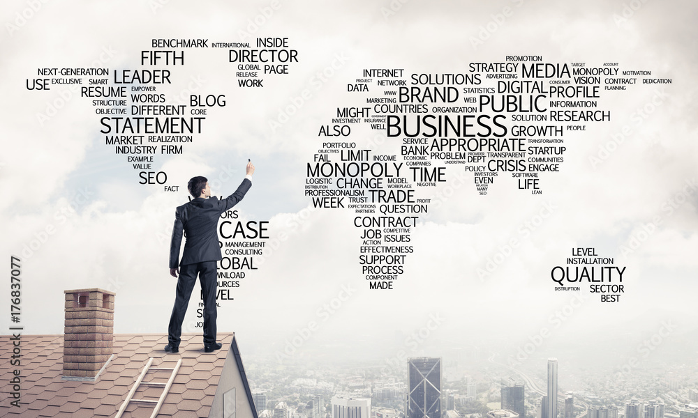 Businessman on brick roof draw world map as concept of globaliza Businessman on brick roof draw world map as concept of globaliza