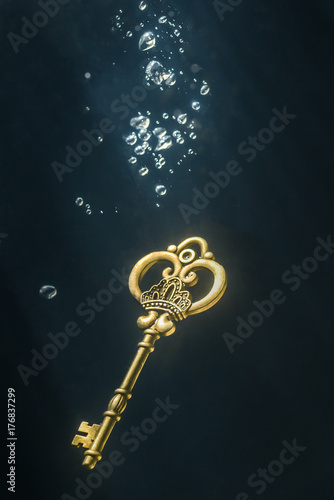Vintage key under water. © Ilias