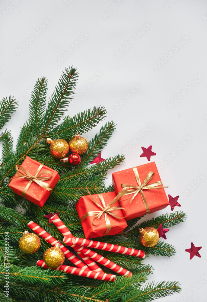 christmas composition, spruce branches to gifts in red boxes, christmas decor