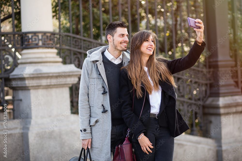 couple taking selfie in the street