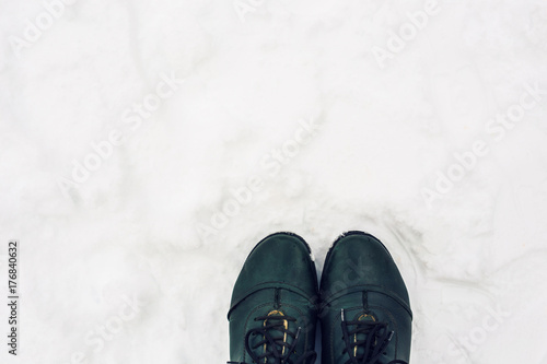 winter shoes in snow, close-up top view