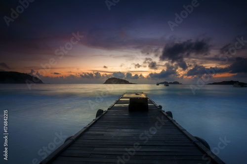scenery of sunset at Redang Island Terengganu Malaysia. Soft focus motion blur due to long exposure. visible noise due to high iso